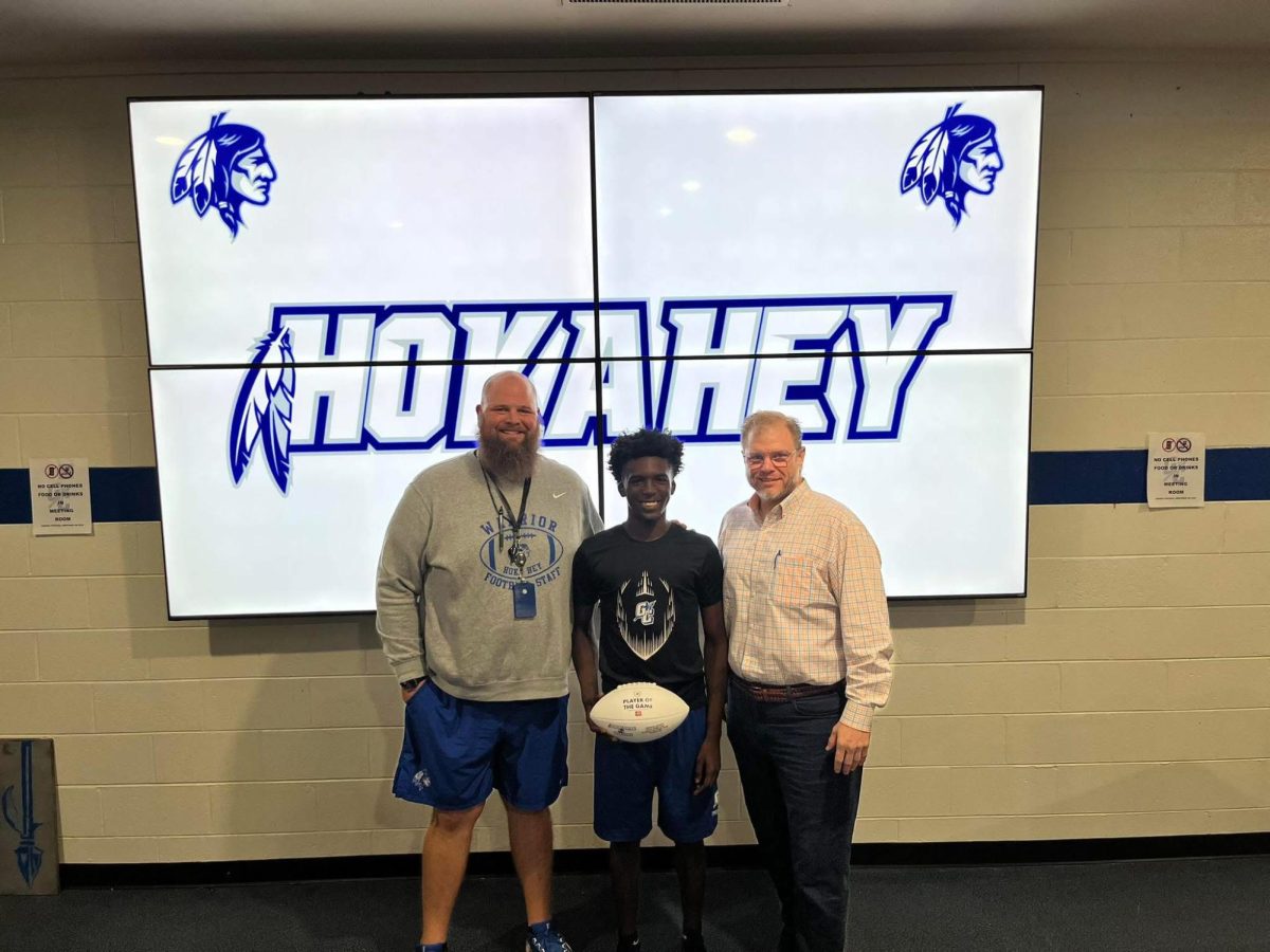 Coach Gowan, TreVeyon Bigby, and Charles Maxwell from the Georgia Farm Bureau, sponsor of Player of the Week