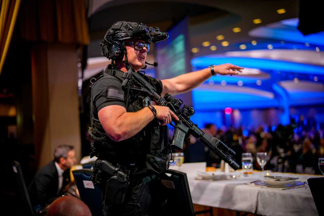 WASHINGTON, DC - APRIL 25: Armed Secret Service agents stand on stage during a shooting incident at the annual White House Correspondents Association Dinner at the Washington Hilton on April 25, 2026 in Washington, DC. According to reports, President Donald Trump, along with other government officials, were evacuated from the Washington Hilton after gun shots. (Photo by Andrew Harnik/Getty Images)